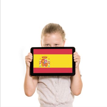 flag of Spain displayed on tablet computer held by young girl