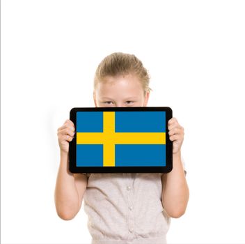 flag os Sweden displayed on a tablet computer held by a young girl