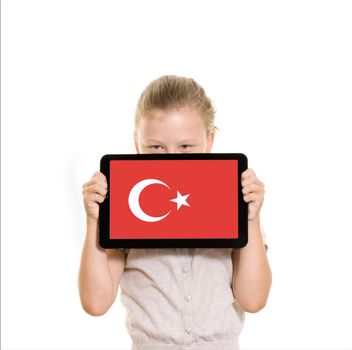 flag of Turkey displayed on tablet computer held by young girl
