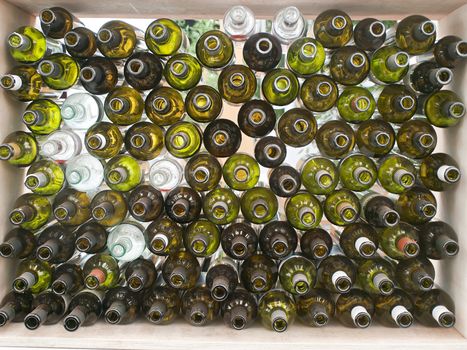 stack of assorted empty wine  bottles