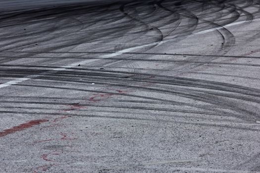 Background with tire marks on road track