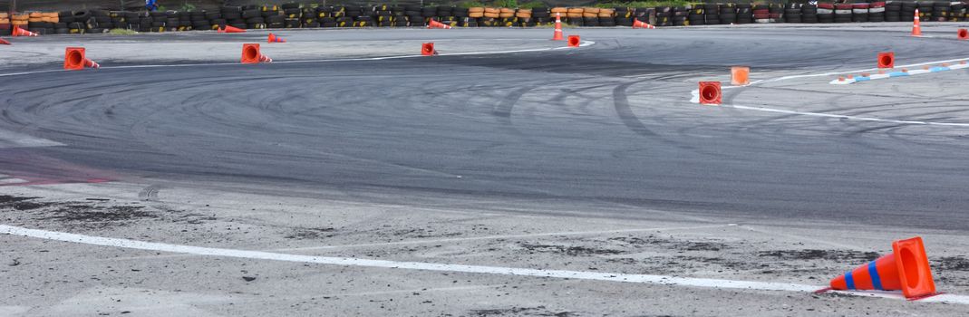 Background with traffic cone on road track