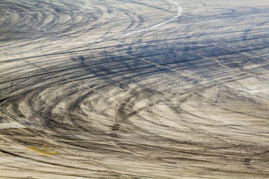 Background with tire marks on road track