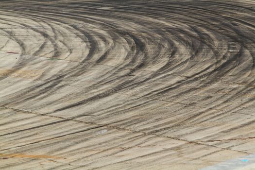 Background with tire marks on road track