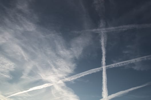 Aircraft contrails cross the sky