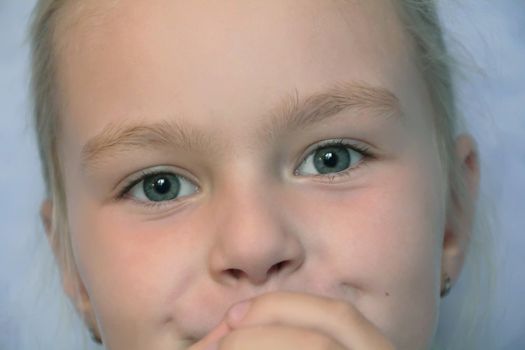 Portrait of beautiful girl with blue eyes