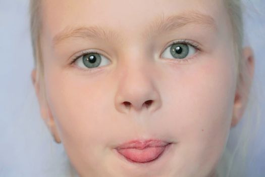 Portrait of beautiful girl with blue eyes