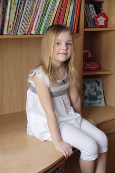 Portrait of beautiful girl on book background