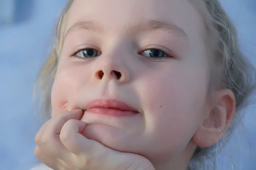 Portrait of beautiful girl with blue eyes