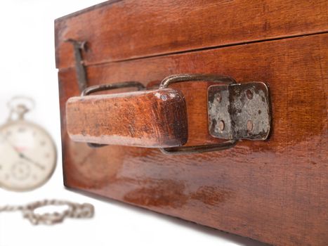 old wooden suitcase and pocket watch