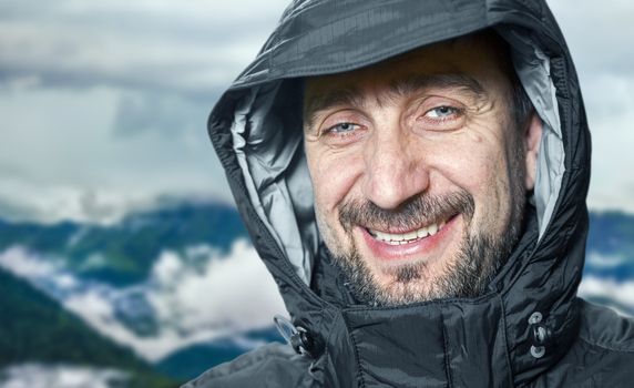 Man enjoy calm evening after climbing on the mountain