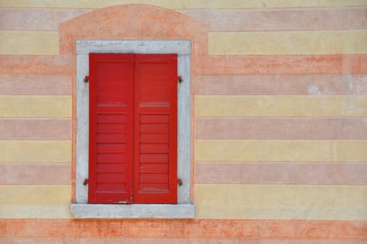 Red balcony in Perarolo town in dolomites montain.