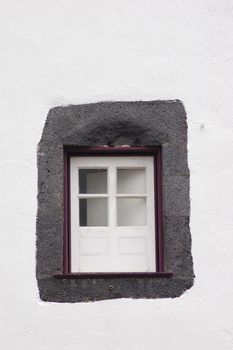Violets small window of a house in san miguel azores