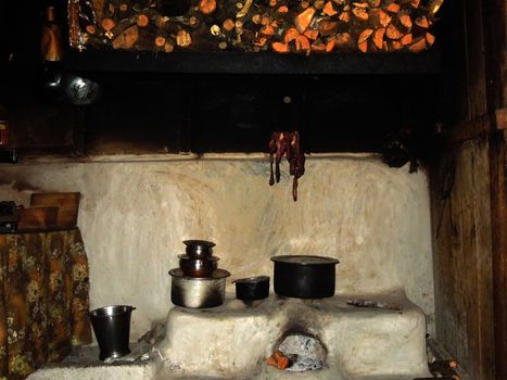 Rural kitchen in a Lepcha village in Sikkim, NE India; meat drying over the stove