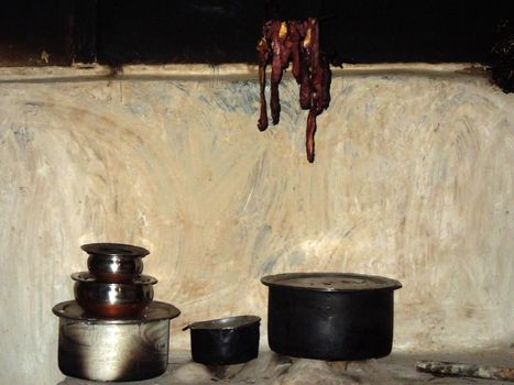 Rural kitchen in a Lepcha village in Sikkim, NE India, meat drying over the fire place