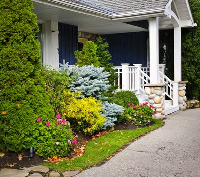 Front entrance of house with garden and porch