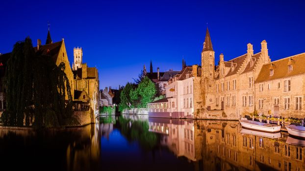 River canal and medieval houses at night, Bruges, Belgium