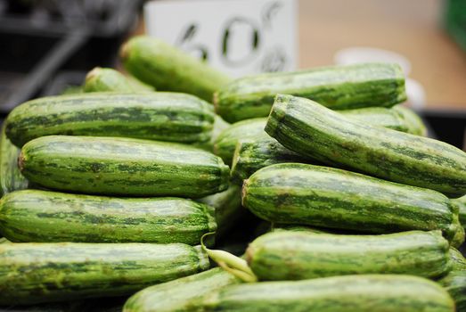 Freshly picked cucumbers for sale in a marketplace