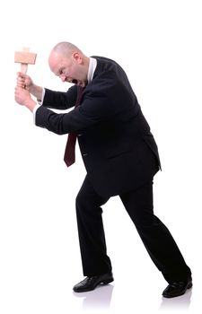 Businessman with wooden mallet hitting against side of image isolated on white