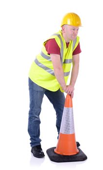 Construction worker setting out a traffic cone  isolated on white