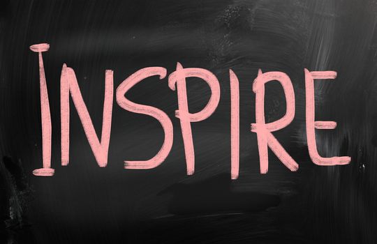 Inspire handwritten with chalk on a blackboard