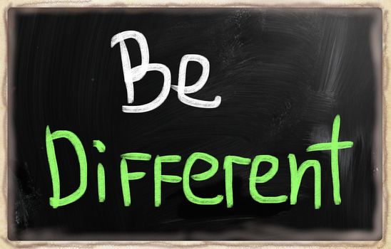 Be different handwritten with chalk on a blackboard