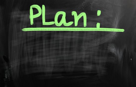 "Business plan" handwritten with white chalk on a blackboard.