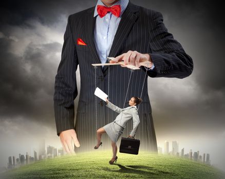 Image of young businessman puppeteer. Leadership concept