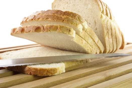 Bread chopping board with slices of white bread