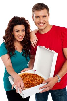 Cheerful love couple enjoying pizza together isolated against white background