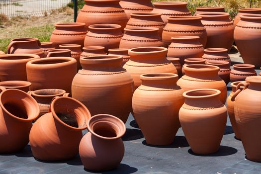 ceramic pots in market, sunny day