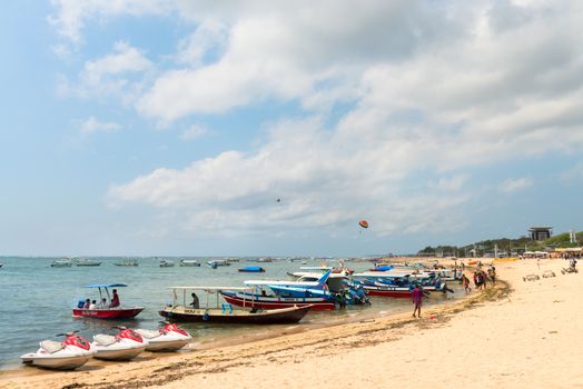 NUSA DUA, BALI - SEP 13: Motor boats on sand beach in Tanjung Benoa area on Sep 13, 2012 in Nusa Dua, Bali. Tanjung Benoa is popular tourist place for  watersport and various games.