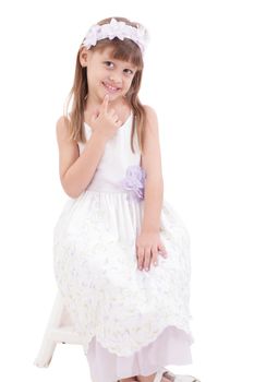 A portrait of a cheerful little girl on the white background