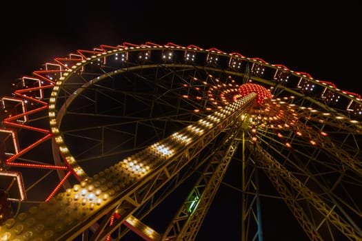 Ferris wheel illuminated in Odessa, Shevchenko Park. Ukraine.