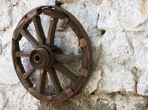 old wheel cart on white wall background