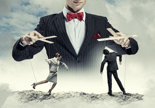 Image of young businessman puppeteer. Leadership concept