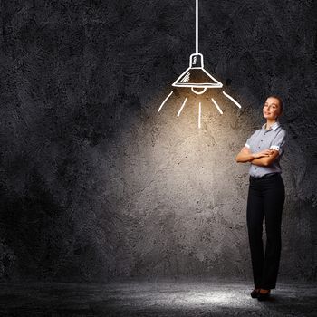 Image of attractive businesswoman against dark background