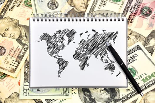 note book with map on background of dollars