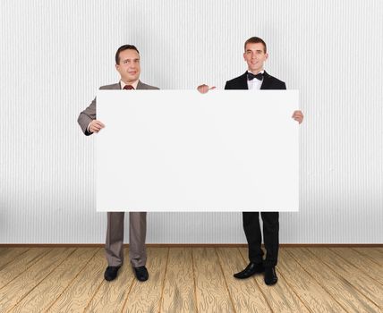 two businessman holding blank placard in office