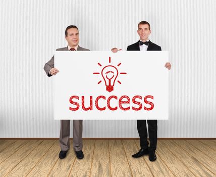 two businessman holding placard with success symbol in office