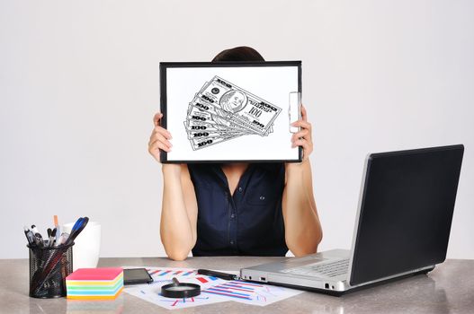 businesswoman holding a clipboard with dollar