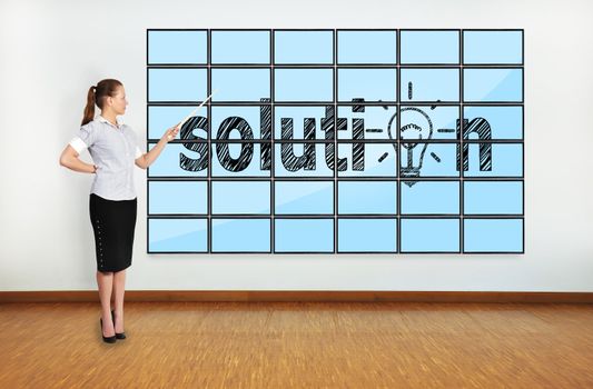businesswoman in office pointing at solution on screen plasma