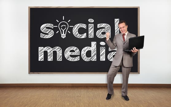 happy businessman and blackboard with social media