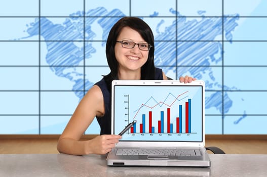 woman with laptop sitting in office