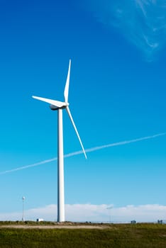 windmill in holland with blue sky