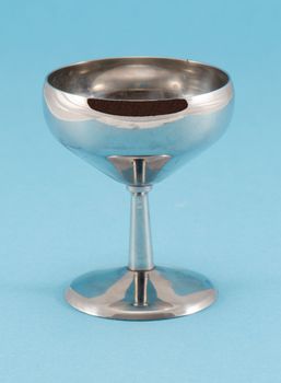 retro grunge wine glass goblet on blue background.