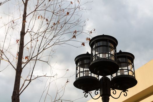 Lamp post and cloudy sky.