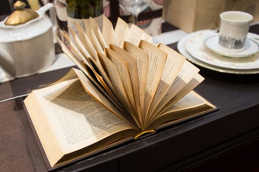 Open book on wooden table