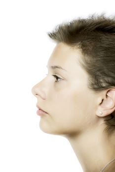 Profile view of a part of a face of a young pretty girl, isolated on white background
