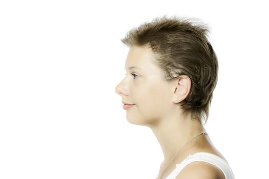 Profile view of a portion of a face of a young pretty girl, isolated on white background